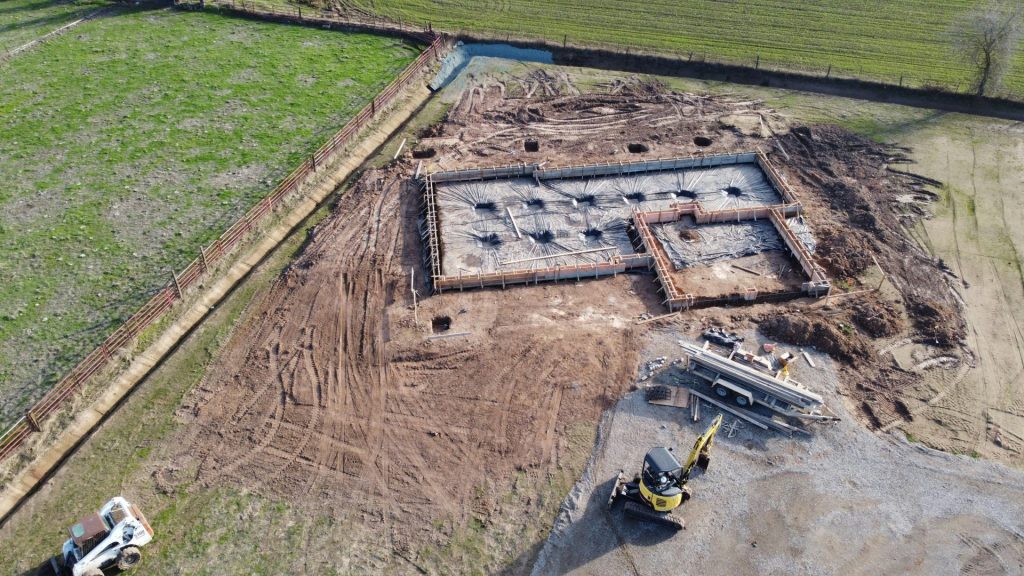 yellow and black heavy equipment on brown field during daytime