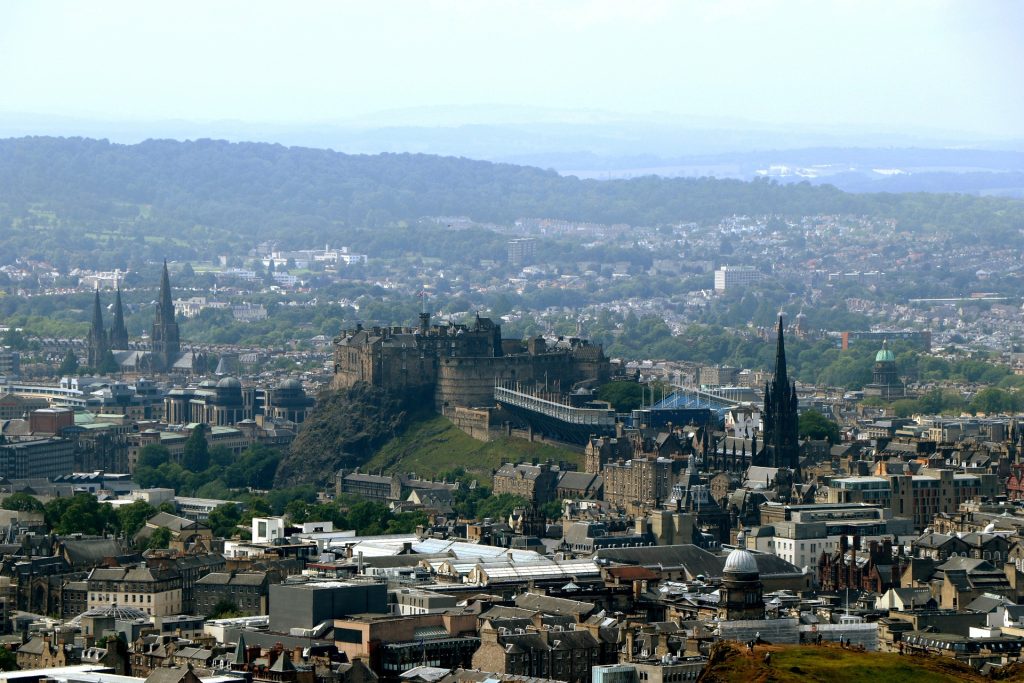 Landscape image of Edinburgh, Scotland showing the full city and surrounding areas such as Bathgate